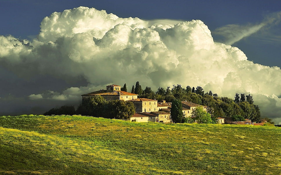 brown and red house on mountain during day time HD wallpaper