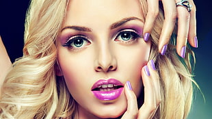 woman wearing a purple eyeshadow and lipstick