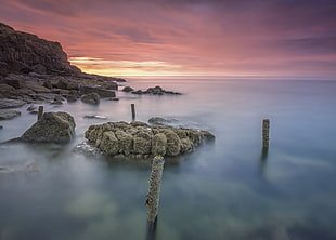 gray stone on body of water, anglesey