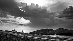 grayscale photograph of three person standing near mountains, romania HD wallpaper