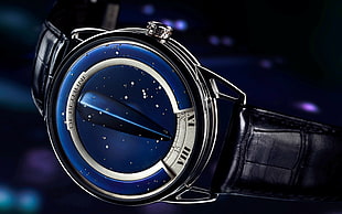 round blue digital watch with black leather bracelet