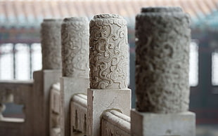 four gray printed columns