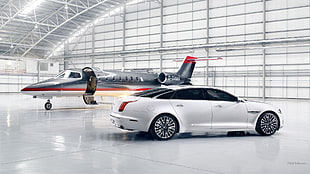 white sedan and gray airplane, Jaguar XJ, Jaguar, aircraft, white cars