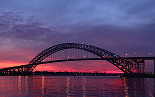 silhouette of steel bridge during sunset