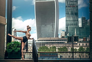 woman performing ballet standing beside hand rial HD wallpaper