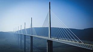 photo of gray metal bridge during day time