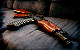 AK-47 rifle on sofa