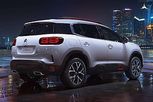 white Citroen C3 Aircross parked on parking lot during nighttime HD wallpaper