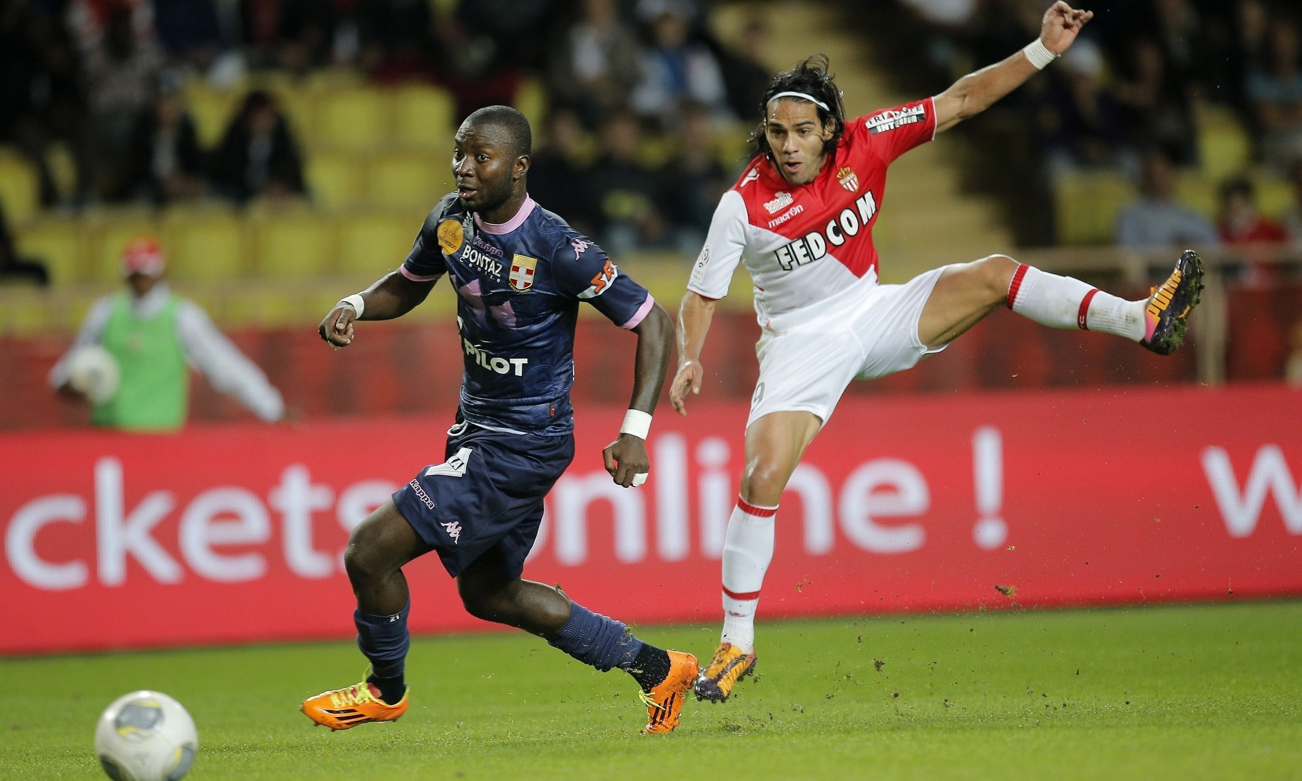 two soccer players playing at the stadium