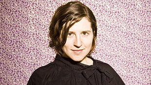 female wearing black bow-accent neckline shirt