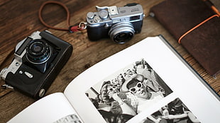 two gray point-in-shot cameras, magazines, camera
