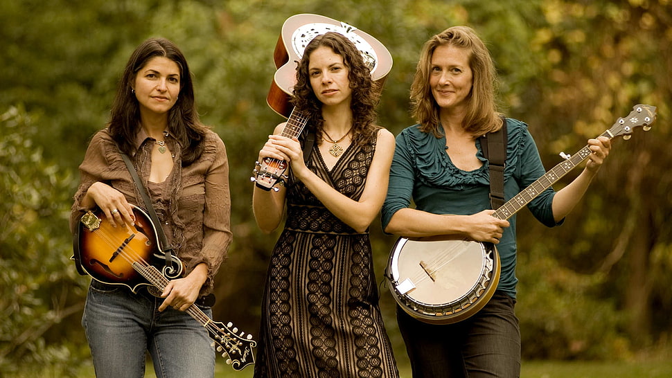 three women's holding musical instruments HD wallpaper