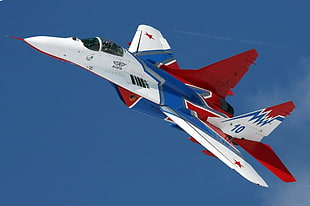 white, blue, and red fighting plane