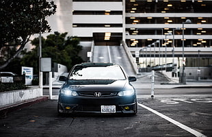 grayscale photograph of Honda Civic on concrete road