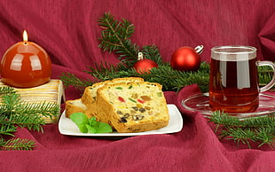 bread beside drink and Christmas bauble