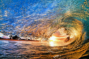 close up photo of wave during sunset