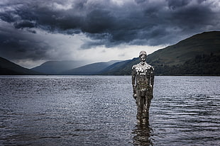 grey metal soldier statue on large body of water HD wallpaper