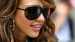 Miley Cyrus wearing black framed sunglasses HD wallpaper
