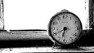 silver-colored alarm clock