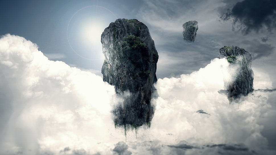 grey rock formation surrounded with clouds greyscale photography HD wallpaper