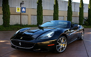 black Ferrari convertible sports car