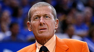 man wears orange blazer
