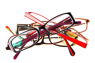 shallow focus photography of assorted color eyeglasses