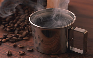 stainless steel mug with coffee