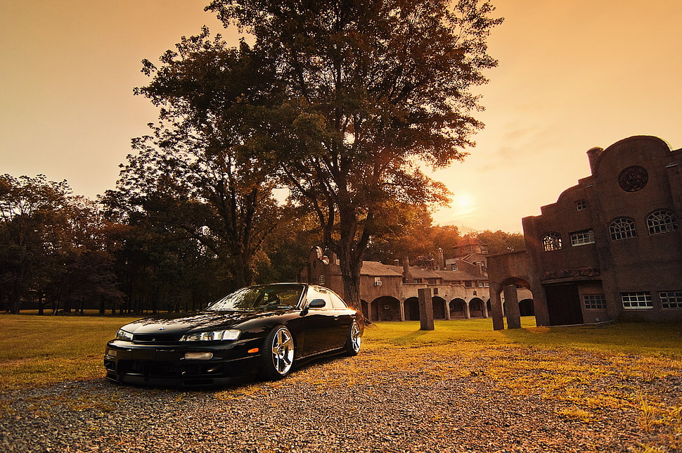 black coupe parked near building during sunset HD wallpaper