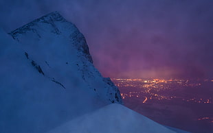 aerial photography of mountain covered with white snow during nighttime