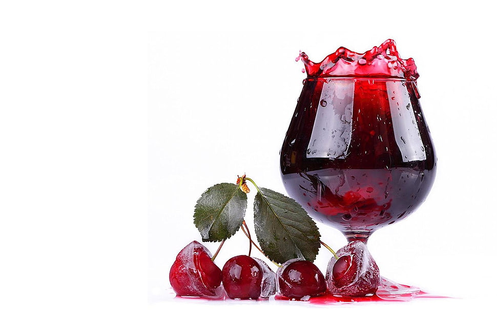 clear short stemmed drinking glass filled with red liquid HD wallpaper