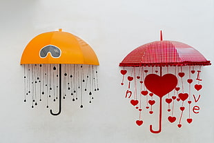 two orange and red umbrella wall decor