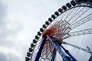 low angle photography of Ferris Wheel under nimbus clouds background