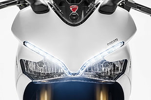 white Ducati sports bike with white LED light