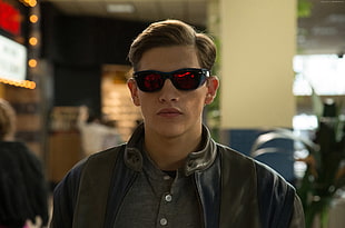 man wearing red tint shade sunglasses with black frame