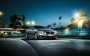 black BMW coupe on road during night time HD wallpaper