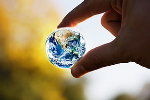 blue marble toy, Earth, globes, miniatures, hands HD wallpaper