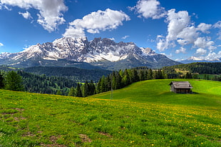 landscape photography of house surrounded with green grass with snowy mountain during daytime, italy, latemar