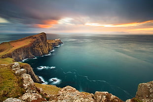 aerial photography of cliff overlooking sea during golden hour, Neist Point, cliff, sea, clouds