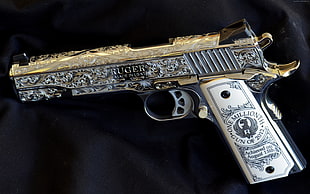 gray and gold-colored Ruger semi-automatic pistol