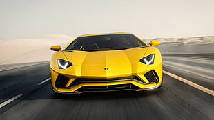 yellow Lamborghini Gallardo on black asphalt road