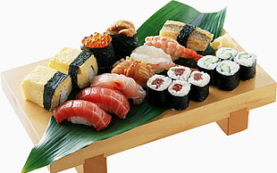 assorted Sushi on brown wooden plate