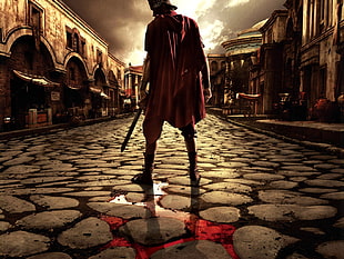 roman soldier holding sword wearing red cape standing on streets
