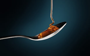 brown syrup on spoon