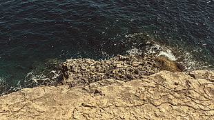 gray and black concrete surface, coast, rock, sea, cliff