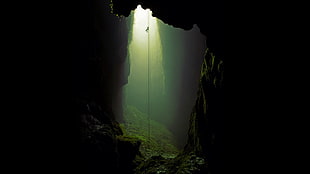silhouette photo of sun rays inside the cave, cave, ropes, climbing, nature