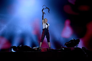 Madonna standing on stage racing animal horn