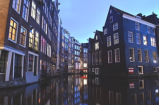 narrow canal between buildings HD wallpaper
