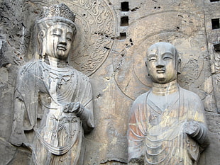 two brown Buddha statues HD wallpaper
