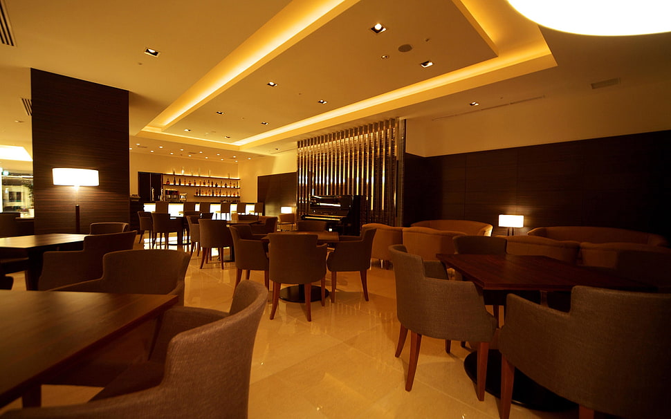 lighted room with chairs and tables HD wallpaper